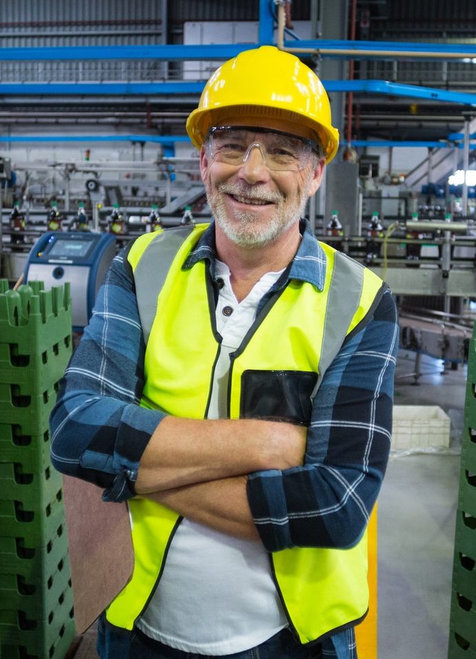 portrait of male factory worker standing with arms crossed e1638169042881